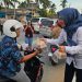 Jasa Raharja dan Ditlantas Polda Kepri Bagi Takjil dan Helm, Edukasi Keselamatan di Simpang Summerland